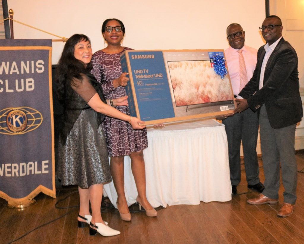 Terry Wong (left), Customer Service Representative, JN Bank Canada Representative Office, present Dr Raphael Djabatey (right), with the gate prize. Also pictured from left are: Monique Broughton, marketing officer, JN Bank Canada Representative Office and Joscelyn Campbell, Senior Manager, Corporate Integrity, The Jamaica National Group.