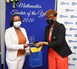 Audrey Williams (right), chief, treasury and investments, JN Bank, presents Kelly Kellier Anderson, Maths Teacher of the Year, with a plaque and a gift certificate, courtesy of JN Bank.