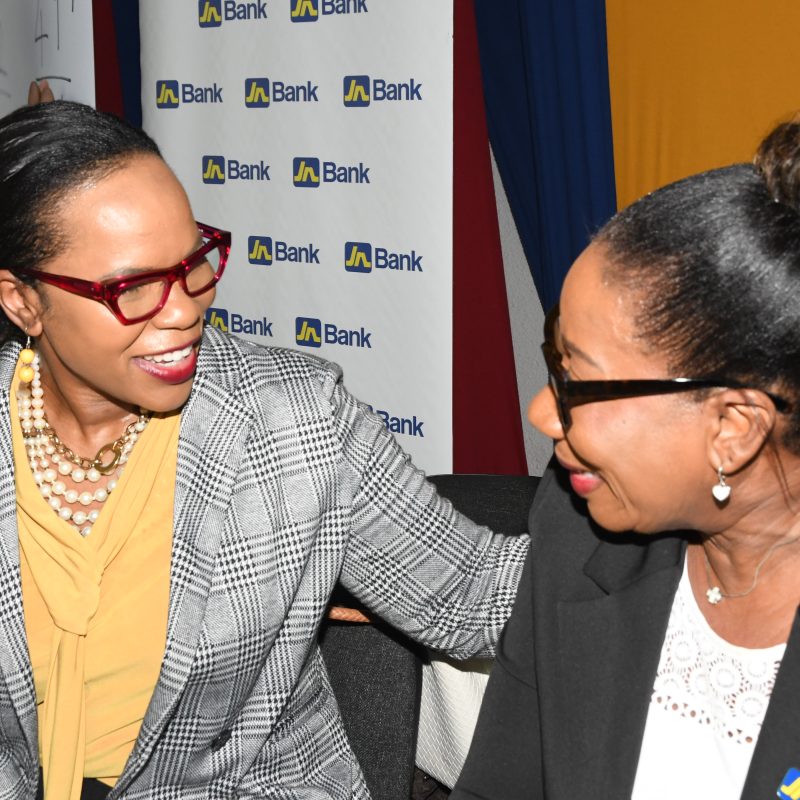 : Sandra Jones (right), Manager for Public Sector Engagement at JN Bank shares a light moment with Dr Kasan Troupe, Permanent Secretary in the Ministry of Education and Youth