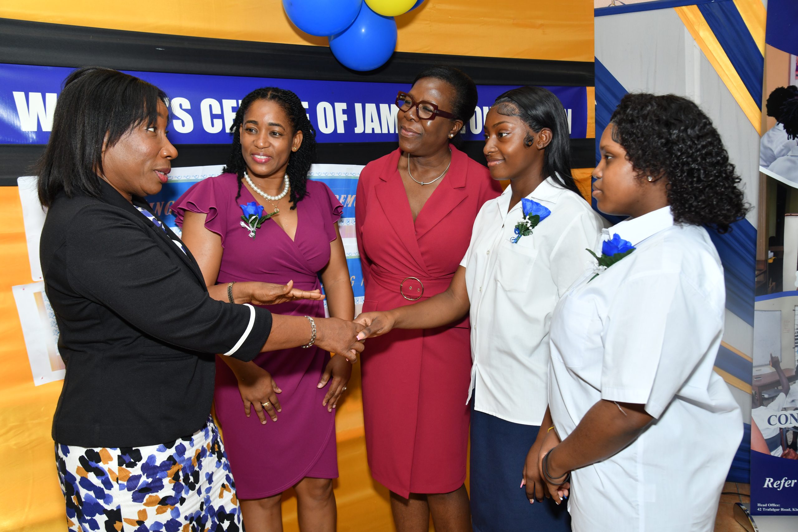 Sandra Jones (left), Manager, Public Sector Engagement, JN Bank, congratulates Nyalia Cookkorne (second right) and Treshanna Thompson (right) on their outstanding academic performance. The occasion was the graduation ceremony for 13 adolescent mothers at the Womenโs Centre of Jamaica in St Andrew on July 2. Sharing in the special moment are Marlene Murray-Brown, Acting Centre Manager and Counsellor, WCJF; and Novlette Howell, Executive Director, WCJF.