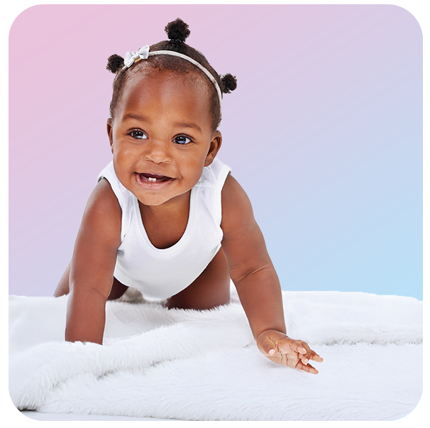 Smiling baby crawling on a soft white blanket with a pastel gradient background.