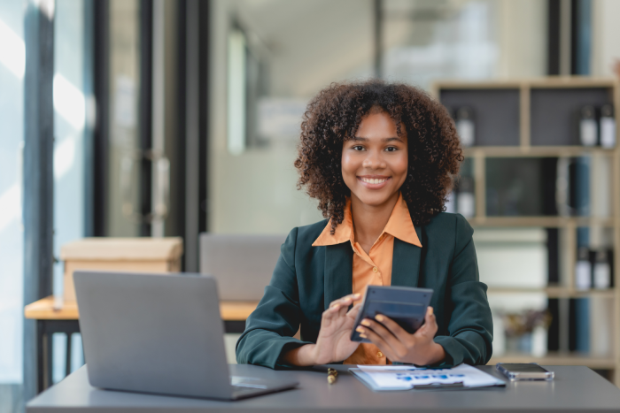 smiling-young-woman-working-in-modern-office-2026-09-23-23-20-48-utc - JN Bank